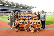 9 July 2023; The Clare team, backrow, left to right, Faye Buckley, Liscarroll NS, Mallow, Cork, Avah Tooher, Coolderry NS, Coolderry, Offaly, Kate Harris, Kinnitty NS, Kinnitty, Offaly, Hollie Earls, Scoil na Maighdine Mhuire, Newmarket on Fergus, Clare, Aoife McGann, Scoil na Maighdine Mhuire, Newmarket on Fergus, Clare, front row, left to right, Grace Gamble, Saint Anne's PS, Finaghy, Antrim, Orna Savage, St Mary’s PS, Portaferry, Down, Lilli Hogan, St Brigid's NS, Arklow, Wicklow, Ella Gallagher, Tooreen NS, Ballyhaunis, Mayo, Alanna Kirby, Ballyduff Central NS, Tralee, Kerry, with INTO President Dorothy McGinley, Uachtarán an Cumann Camógaíochta Hilda Breslin, President of Cumann na mBunscol Mairéad O'Callaghan, and Chairman Munster council Ger Ryan ahead of the GAA INTO Cumann na mBunscol Respect Exhibition Go Games at the GAA Hurling All-Ireland Senior Championship semi-final match between Kilkenny and Clare at Croke Park in Dublin. Photo by Daire Brennan/Sportsfile