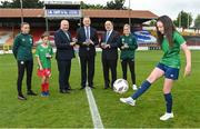 14 July 2023; Pictured at the launch of the Republic of Ireland women's national team commemorative coin are, from left, Republic of Ireland women's national team player Abbie Larkin, Daisy White, age 11, of Shelbourne, FAI President Gerry McAnaney, Minister of State at Department of Tourism, Culture, Arts, Gaeltacht, Sport and Media Thomas Byrne TD, Governor of the Central Bank of Ireland Gabriel Makhlouf, Republic of Ireland women's national team player Jamie Finn, and Ellie O'Mahony, age 13, of Shelbourne, at Tolka Park in Dublin. Photo by Seb Daly/Sportsfile