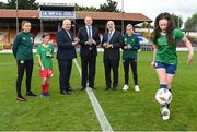 14 July 2023; Pictured at the launch of the Republic of Ireland women's national team commemorative coin are, from left, Republic of Ireland women's national team player Abbie Larkin, Daisy White, age 11, of Shelbourne, FAI President Gerry McAnaney, Minister of State at Department of Tourism, Culture, Arts, Gaeltacht, Sport and Media Thomas Byrne TD, Governor of the Central Bank of Ireland Gabriel Makhlouf, Republic of Ireland women's national team player Jamie Finn, and Ellie O'Mahony, age 13, of Shelbourne, at Tolka Park in Dublin. Photo by Seb Daly/Sportsfile