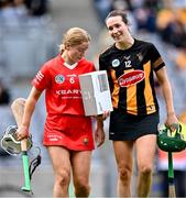 9 July 2023; Denise Gaule of Kilkenny shows the radio she won for being player of the match to Laura Treacy of Cork after the All-Ireland Senior Camogie Championship quarter-final match between Cork and Kilkenny at Croke Park in Dublin. Photo by Piaras Ó Mídheach/Sportsfile