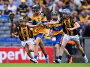 9 July 2023; James Verling, Leugh NS, Thurles, Tipperary, representing Clare in action against Paul Ralph, St Brendan's NS, Drummond, St Mullins, Carlow, representing Kilkenny, 2, and Oliver Clarke, Killinkere NS, Virginia, Cavan, representing Kilkenny, 3, during the GAA INTO Cumann na mBunscol Respect Exhibition Go Games at the GAA Hurling All-Ireland Senior Championship semi-final match between Kilkenny and Clare at Croke Park in Dublin. Photo by Piaras Ó Mídheach/Sportsfile