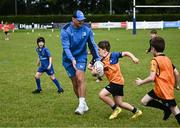12 July 2023; Paul Cullen with Leinster player Rhys Ruddock during a Bank of Ireland Leinster Rugby summer camp at County Carlow FC in Carlow.  Photo by Harry Murphy/Sportsfile