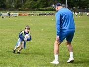 12 July 2023; Jack O'Shea with Leinster player Rhys Ruddock during a Bank of Ireland Leinster Rugby summer camp at County Carlow FC in Carlow.  Photo by Harry Murphy/Sportsfile
