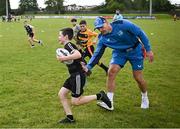 12 July 2023; Cathal Leigh and Leinster player Rhys Ruddock during a Bank of Ireland Leinster Rugby summer camp at County Carlow FC in Carlow.  Photo by Harry Murphy/Sportsfile