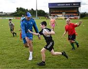 12 July 2023; Cathal Leigh and Leinster player Rhys Ruddock during a Bank of Ireland Leinster Rugby summer camp at County Carlow FC in Carlow.  Photo by Harry Murphy/Sportsfile