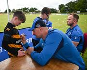 12 July 2023; Leinster players Rhys Ruddock and Ed Byrne sign autographs during a Bank of Ireland Leinster Rugby summer camp at County Carlow FC in Carlow.  Photo by Harry Murphy/Sportsfile