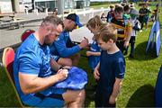 12 July 2023; Leinster players Ed Byrne and Rhys Ruddock sign autographs during a Bank of Ireland Leinster Rugby summer camp at County Carlow FC in Carlow.  Photo by Harry Murphy/Sportsfile
