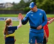 12 July 2023; Leinster player Rhys Ruddock high fives Clodagh Phelan during a Bank of Ireland Leinster Rugby summer camp at County Carlow FC in Carlow.  Photo by Harry Murphy/Sportsfile