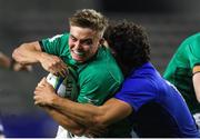 14 July 2023; Fintan Gunne of Ireland is tackled by Leo Drouet of France during the U20 Rugby World Cup Final between Ireland and France at Athlone Sports Stadium in Cape Town, South Africa. Photo by Shaun Roy/Sportsfile