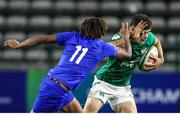14 July 2023; James Nicholson of Ireland in action against Theo Attissogbe of France during the U20 Rugby World Cup Final match between Ireland and France at Athlone Sports Stadium in Cape Town, South Africa. Photo by Shaun Roy/Sportsfile