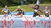 14 July 2023; Sarah Lavin of Ireland and Emerald AC, Limerick, centre left, on her way to winning the Davy women's 100m hurdles, ahead of Ebony Morrison of Liberia,  centre right, during the 2023 Morton Games at Morton Stadium in Santry, Dublin. Photo by Sam Barnes/Sportsfile
