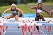 14 July 2023; Sarah Lavin of Ireland and Emerald AC, Limerick, left,  on her way to winning the Davy women's 100m hurdles, ahead of Ebony Morrison of Liberia, right, during the 2023 Morton Games at Morton Stadium in Santry, Dublin. Photo by Sam Barnes/Sportsfile