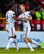 14 July 2023; Jonathan Afolabi of Bohemians, left, celebrates after scoring his side's first goal with Bartlomiej Kukulowicz during the SSE Airtricity Men's Premier Division match between Shelbourne and Bohemians at Tolka Park in Dublin. Photo by Stephen Marken/Sportsfile