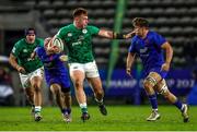 14 July 2023; Fiachna Barrett of Ireland attempts to hand off Marko Gazzotti of France during the U20 Rugby World Cup Final between Ireland and France at Athlone Sports Stadium in Cape Town, South Africa. Photo by Shaun Roy/Sportsfile