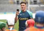 8 October 2016; Wexford hurler Lee Chin takes a picture of youth participants in Croke Park today which played host to some of Ireland’s most talented hurlers, along with over 500 children, who lined-out to learn tips and skills from their hurling heroes as part of Centra’s Live Well hurling initiative. The participating children, who experienced a once in a lifetime opportunity, came from 12 lucky GAA clubs who each claimed their very special spot by winning a Live Well hurling challenge during the summer. Croke Park, Dublin. Photo by Cody Glenn/Sportsfile