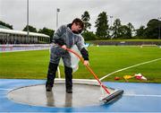 15 July 2023; Lorraine Doherty from Rosses AC clears water from the shot put throwing circle during day one of the 123.ie National AAI Games and Combines at Morton Stadium in Santry, Dublin. Photo by Stephen Marken/Sportsfile