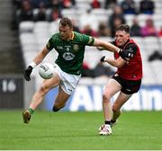 15 July 2023; Karl Gallagher of Monaghan is tackled by Miceal Rooney of Down during the Tailteann Cup Final match between Down and Meath at Croke Park in Dublin. Photo by Brendan Moran/Sportsfile