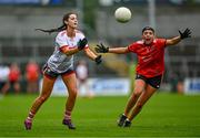 15 July 2023; Eimear Meaney of Cork in action against Niamh Coleman of Armagh during the TG4 Ladies Football All-Ireland Senior Championship quarter-final match between Armagh and Cork at BOX-IT Athletic Grounds in Armagh. Photo by Ben McShane/Sportsfile