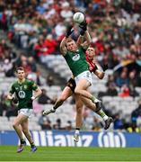15 July 2023; Adam O'Neill of Meath, left, looks on as Jack Flynn of Meath catches the ball ahead of Pat Havern of Down during the Tailteann Cup Final match between Down and Meath at Croke Park in Dublin. Photo by Brendan Moran/Sportsfile