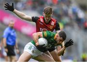 15 July 2023; Donal Keogan of Meath is tackled by Odhran Murdock of Down during the Tailteann Cup Final match between Down and Meath at Croke Park in Dublin. Photo by John Sheridan/Sportsfile