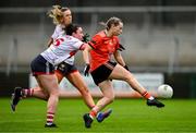 15 July 2023; Aoife McCoy of Armagh scores a point under pressure from Shauna Kelly of Cork during the TG4 Ladies Football All-Ireland Senior Championship quarter-final match between Armagh and Cork at BOX-IT Athletic Grounds in Armagh. Photo by Ben McShane/Sportsfile