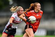 15 July 2023; Blaithín Mackin of Armagh evades the tackle of Emma Cleary of Cork during the TG4 Ladies Football All-Ireland Senior Championship quarter-final match between Armagh and Cork at BOX-IT Athletic Grounds in Armagh. Photo by Ben McShane/Sportsfile