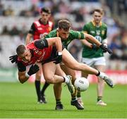 15 July 2023; Pat Havern of Down is tackled by Seán Coffey of Meath during the Tailteann Cup Final match between Down and Meath at Croke Park in Dublin. Photo by Brendan Moran/Sportsfile