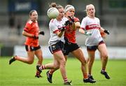 15 July 2023; Melissa Duggan of Cork is tackled by Lauren McConville of Armagh  during the TG4 Ladies Football All-Ireland Senior Championship quarter-final match between Armagh and Cork at BOX-IT Athletic Grounds in Armagh. Photo by Ben McShane/Sportsfile