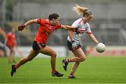 15 July 2023; Daire Kiely of Cork in action against Emily Druse of Armagh during the TG4 Ladies Football All-Ireland Senior Championship quarter-final match between Armagh and Cork at BOX-IT Athletic Grounds in Armagh. Photo by Ben McShane/Sportsfile