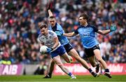 15 July 2023; Karl O'Connell of Monaghan is tackled by Brian Fenton, left, and Michael Fitzsimons of Dublin during the GAA Football All-Ireland Senior Championship semi-final match between Dublin and Monaghan at Croke Park in Dublin. Photo by Ramsey Cardy/Sportsfile