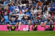 15 July 2023; Brian Fenton of Dublin, with Ciaran Kilkenny in support, kicks a point under pressure fron Kieran Duffy and Gary Mohan of Monaghan during the GAA Football All-Ireland Senior Championship semi-final match between Dublin and Monaghan at Croke Park in Dublin. Photo by Brendan Moran/Sportsfile