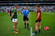 15 July 2023; Referee Noel Mooney performs the coin toss in the company of Meath captain Donal Keogan and Down captain Pierce Laverty before the Tailteann Cup Final match between Down and Meath at Croke Park in Dublin. Photo by Brendan Moran/Sportsfile