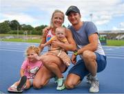 16 July 2023; Mary Horgan of Crusaders AC, Dublin, with her husband Rob Lee and children Sibéal, age 3, and Fred, age 7 months, during day two of the 123.ie National AAI Games and Combines at Morton Stadium in Santry, Dublin. Photo by Stephen Marken/Sportsfile
