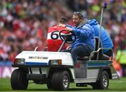 16 July 2023; Gareth McKinless of Derry is assisted by medical personnel as he is carried off the pitch, in injury time, during the GAA Football All-Ireland Senior Championship Semi-Final match between Derry and Kerry at Croke Park in Dublin. Photo by John Sheridan/Sportsfile