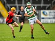 16 July 2023; Peter Fortune of St Fechin's in action against Fergal O'Kelly-Lynch of Naomh Eoin during the 2023 CúChulainn Hurling League Division 2 Final match between Naomh Eoin, Sligo, and St Fechin’s, Louth, at Kingspan Breffni Park in Cavan. Photo by Oliver McVeigh/Sportsfile