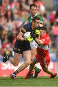 16 July 2023; Kerry goalkeeper Shane Ryan is tackled by Gareth McKinless of Derry during the GAA Football All-Ireland Senior Championship Semi-Final match between Derry and Kerry at Croke Park in Dublin. Photo by John Sheridan/Sportsfile