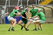 16 July 2023; Eoghan Hoey of Carrickmacross in action against James Brady and Adrian Dalton of Monaghan Harps during the 2023 CúChulainn Hurling League Division 3 Final match between Carrickmacross, Monaghan, and Monaghan Harps, Monaghan, at Kingspan Breffni Park in Cavan. Photo by Oliver McVeigh/Sportsfile
