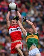 16 July 2023; Brendan Rogers of Derry catches a kickout ahead of Jack Barry of Kerry during the GAA Football All-Ireland Senior Championship Semi-Final match between Derry and Kerry at Croke Park in Dublin. Photo by Brendan Moran/Sportsfile