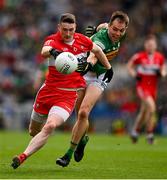 16 July 2023; Gareth McKinless of Derry is tackled by Jack Barry of Kerry during the GAA Football All-Ireland Senior Championship Semi-Final match between Derry and Kerry at Croke Park in Dublin. Photo by Brendan Moran/Sportsfile