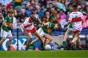 16 July 2023; Aaron O'Brien, Caherline N.S., Caherconlish, Limerick, representing Kerry, in action against Noah McGuire, Scoil An Chaisil, Glean Cholm Cille, Donegal, representing Derry, during the INTO Cumann na mBunscol GAA Respect Exhibition Go Games at the GAA Football All-Ireland Senior Championship Semi-Final match between Derry and Kerry at Croke Park in Dublin. Photo by Piaras Ó Mídheach/Sportsfile