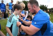 17 July 2023; Ed Byrne signs autographs after a Leinster rugby squad training and gym session at Wicklow RFC in Wicklow. Photo by Brendan Moran/Sportsfile