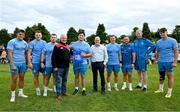 17 July 2023; Thomas Clarkson makes a presentation to Wicklow RFC president Graham Burleigh, fourth from left, and immediate past president Brian Clarke, in the company of head coach Leo Cullen and playrs, from left, Aitzol King, Lee Gannon, John McKee, Scott Penny, Ed Byrne and Brian Deeny after a Leinster rugby squad training and gym session at Wicklow RFC in Wicklow. Photo by Brendan Moran/Sportsfile