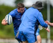 17 July 2023; Scott Penny is tackled by forwards and scrum coach Robin McBryde during a Leinster rugby squad training and gym session at Wicklow RFC in Wicklow. Photo by Brendan Moran/Sportsfile