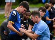 17 July 2023; Luke McGrath signs autographs for supporters after a Leinster rugby squad training and gym session at Wicklow RFC in Wicklow. Photo by Brendan Moran/Sportsfile