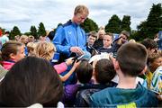 17 July 2023; Head coach Leo Cullen signs autographs for supporters after a Leinster rugby squad training and gym session at Wicklow RFC in Wicklow. Photo by Brendan Moran/Sportsfile