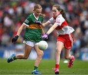 16 July 2023; Niamh Ni Luasaigh, Ballythomas N.S., Gorey, Wexford, representing Kerry, in action against Katelyn Richardson, Scoil Mhuire Naofa, Carrigallen, Leitrim, representing Derry, during the INTO Cumann na mBunscol GAA Respect Exhibition Go Games at the GAA Football All-Ireland Senior Championship Semi-Final match between Derry and Kerry at Croke Park in Dublin. Photo by Brendan Moran/Sportsfile