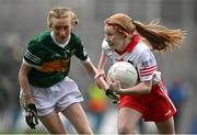 16 July 2023; Alisha Ni Tyrrell, Gaelscoil Lorgan, Baile na Lorgan, Muineachán, representing Derry, in action against Niamh Woods, Glor na Mara N.S, Tramore, Waterford, representing Kerry, during the INTO Cumann na mBunscol GAA Respect Exhibition Go Games at the GAA Football All-Ireland Senior Championship Semi-Final match between Derry and Kerry at Croke Park in Dublin. Photo by Brendan Moran/Sportsfile