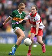 16 July 2023; Niamh Ni Luasaigh, Ballythomas N.S., Gorey, Wexford, representing Kerry, in action against Katelyn Richardson, Scoil Mhuire Naofa, Carrigallen, Leitrim, representing Derry, during the INTO Cumann na mBunscol GAA Respect Exhibition Go Games at the GAA Football All-Ireland Senior Championship Semi-Final match between Derry and Kerry at Croke Park in Dublin. Photo by Brendan Moran/Sportsfile