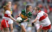16 July 2023; Eve Lapthorne, St Mary's N.S., Bishopscourt, Waterford, representing Kerry, in action againstAlisha Ni Tyrrell, Gaelscoil Lorgan, Baile na Lorgan, Muineachán, representing Derry, left, and  Amy Deighan, St Canice P.S., Dungiven, Derry, representing Derry, during the INTO Cumann na mBunscol GAA Respect Exhibition Go Games at the GAA Football All-Ireland Senior Championship Semi-Final match between Derry and Kerry at Croke Park in Dublin. Photo by Brendan Moran/Sportsfile