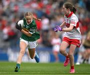 16 July 2023; Niamh Ni Luasaigh, Ballythomas N.S., Gorey, Wexford, representing Kerry, in action against Amy Deighan, St Canice P.S., Dungiven, Derry, representing Derry, during the INTO Cumann na mBunscol GAA Respect Exhibition Go Games at the GAA Football All-Ireland Senior Championship Semi-Final match between Derry and Kerry at Croke Park in Dublin. Photo by Brendan Moran/Sportsfile